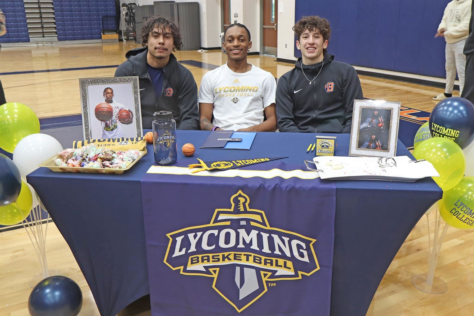 Bridgeland High School senior Aiden White, center, signed a letter of intent to play basketball at Lycoming College.